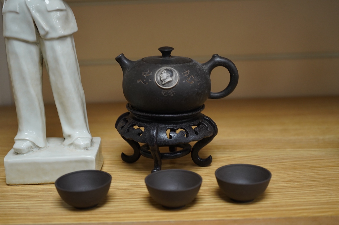 A Chinese cultural revolution Communist party figure together with a Mao teapot and three tea bowls, largest 31cm high. Condition - good